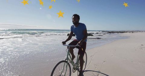 Male cyclist enjoys breathtaking beach ride under starry overlay