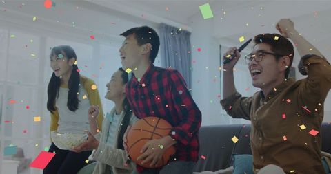 Family Celebrating Sports Victory with Confetti and Joyful Cheers