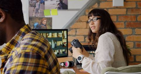 Creative Graphic Designers Collaborating on Photography Project