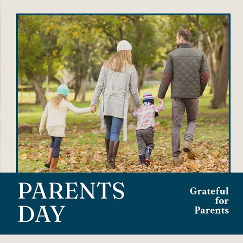 Family strolling hand in hand during parents day outing