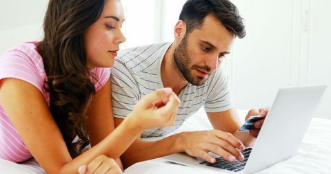 Couple Online Shopping at Home in Cozy Bedroom Setting - Download Free Stock Images Pikwizard.com