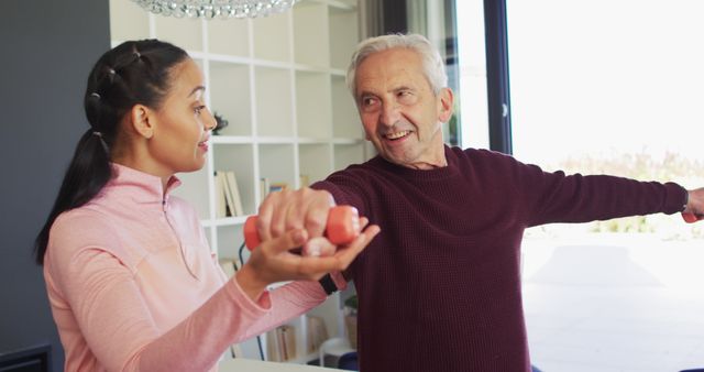 Senior Man Exercising with Trainer, Lifting Dumbbells - Download Free Stock Images Pikwizard.com