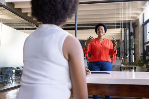 Dynamic Office Meeting with Engaged Coworkers Sharing Ideas