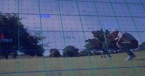 Golfer Lining Up Putt with Digital Grid Overlay and Copy Space