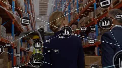 Corporate Team Analyzing Digital Data in Modern Warehouse