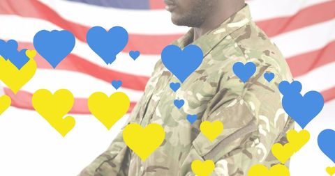Soldier in Camouflage with Overlay of Heart Symbols on American Flag