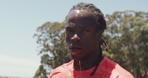 Motivated athlete sweating during intense outdoor fitness session
