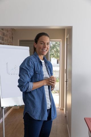 Casual Businesswoman Presenting Data with Confidence