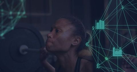 Female athlete squatting with loaded barbell showing strength and focus, teal data overlay