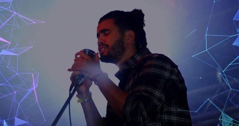 Passionate vocalist performing on stage with digital projections