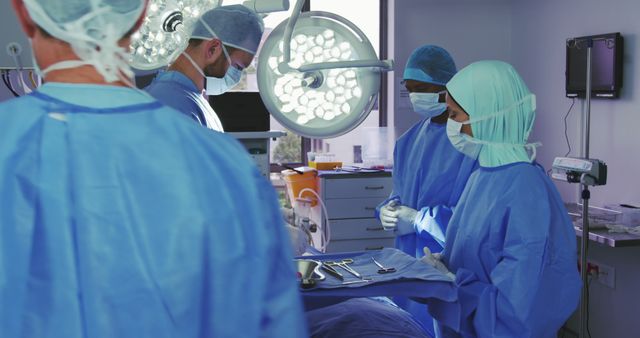 Surgeons Performing Medical Operation in High-Tech Operating Room - Download Free Stock Images Pikwizard.com