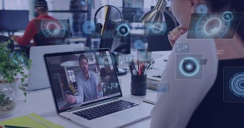Watching Remote Video Call with Augmented HUD Overlays in Modern Coworking Workspace