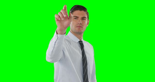 Businessman Interacting with Virtual Interface on Green Screen Background - Download Free Stock Images Pikwizard.com