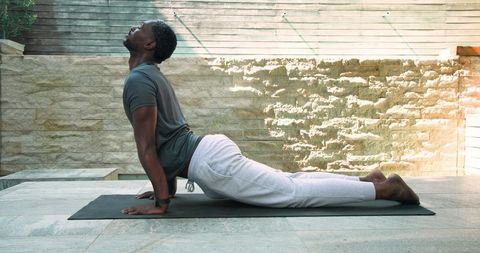 Man Practicing Yoga Backbend Pose Outdoors for Wellness