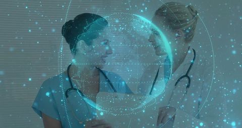 Female Medical Professionals Examining Holographic Healthcare Technology