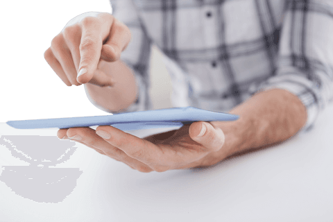 Transparent image of casual man using tablet digitally