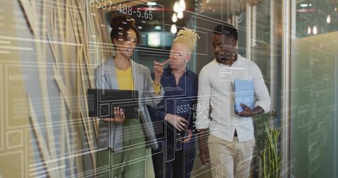 Diverse Team Collaborates While Engaging with Futuristic Data Interfaces