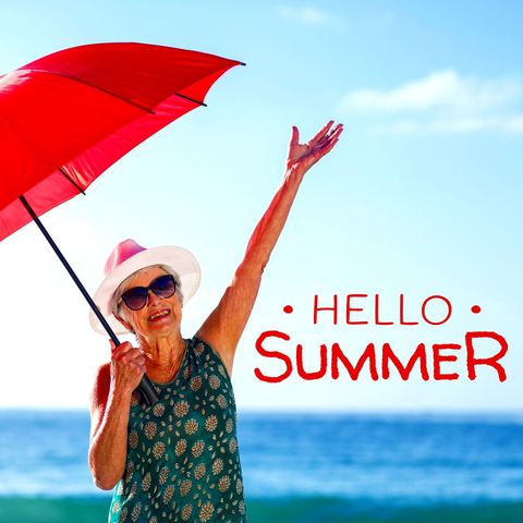 Senior Woman Enjoying Beach with Red Umbrella in Summer