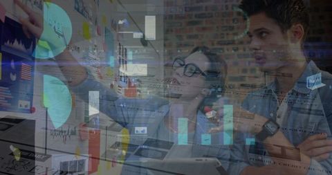 Team analyzing interactive digital data on screen in modern office