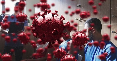 Football players with coach, digital virus cells overlay