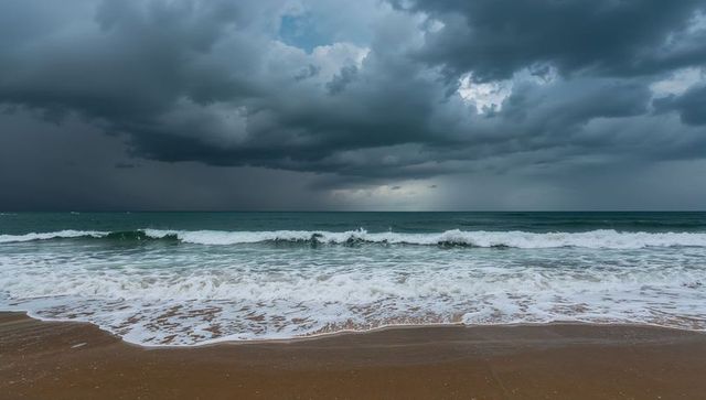 Dramatic Ocean Waves Surging Under Dark Storm Clouds