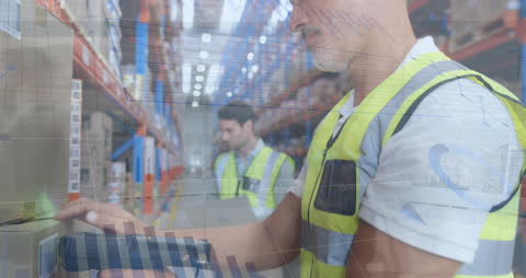 Warehouse Employees Analyzing Data with Modern Technology