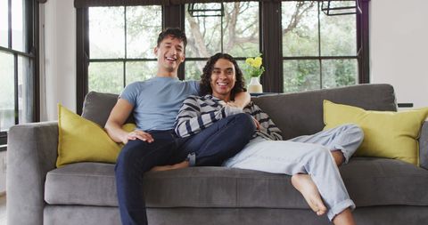 Cheerful Diverse Men Relaxing on Cozy Living Room Sofa - Download Free Stock Images Pikwizard.com