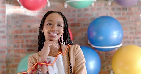 Confident Businesswoman Analyzing Data with Growth Chart Overlay