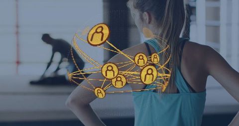 Woman viewing golden connected fitness network overlay in gym for smart training and tracking