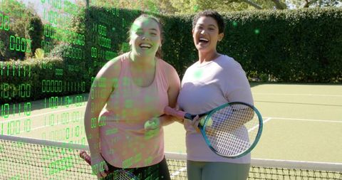 Two women laughing holding tennis racket and ball on sunny court with green binary overlay