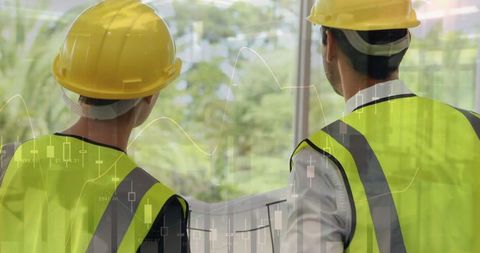 Architects Analyzing Construction Plans with Financial Overlay - Download Free Stock Images Pikwizard.com