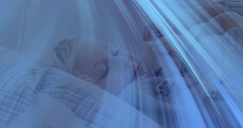 Sleeping child with plush toy in cozy bedroom