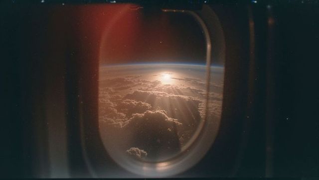 Breathtaking aerial view of sunlit clouds at cruising altitude