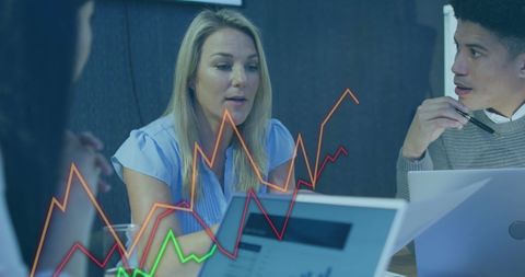 Business Team Analyzing Financial Trends in Office