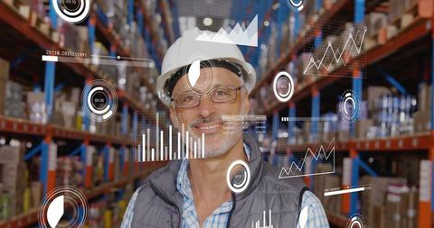 Mature warehouse supervisor wearing hard hat monitoring ar analytics overlay for smart logistics