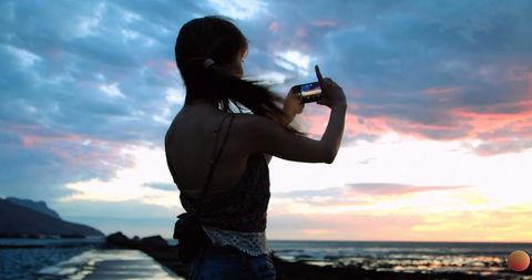 Caucasian Woman Taking Selfie at Beach Sunset - Download Free Stock Images Pikwizard.com