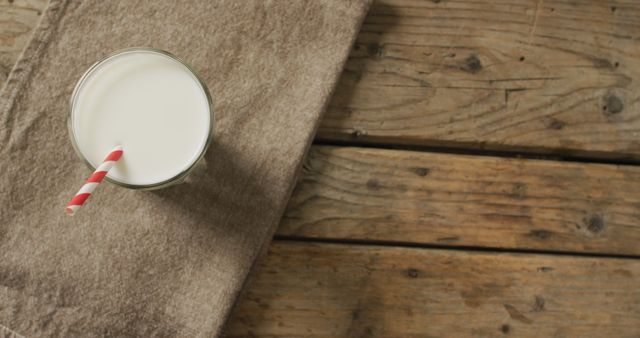 Glass of Milk with Straw on Wooden Table - Download Free Stock Images Pikwizard.com