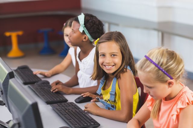 Schoolgirls Using Computers in Classroom - Download Free Stock Photos Pikwizard.com