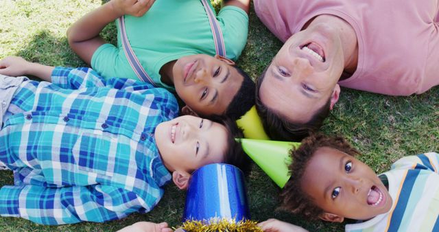 Joyful Celebration Outdoors: Diverse Children with Adult in Vibrant Setting - Download Free Stock Images Pikwizard.com