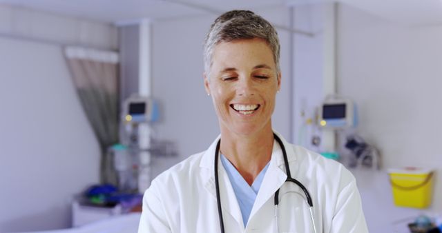 Smiling Medical Professional in Hospital Room with Modern Equipment - Download Free Stock Images Pikwizard.com