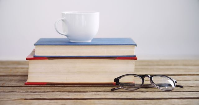 Books and Coffee Mug on Wooden Table with Glasses - Download Free Stock Images Pikwizard.com