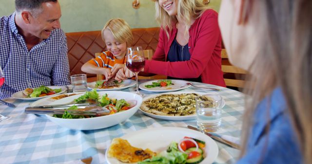 Happy Family Enjoying Lunch at Restaurant - Download Free Stock Images Pikwizard.com