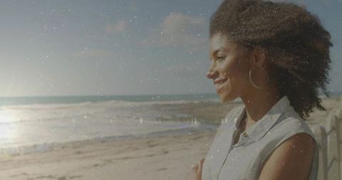 Woman Enjoying Tranquility at Sandy Beach in Sunset Glow