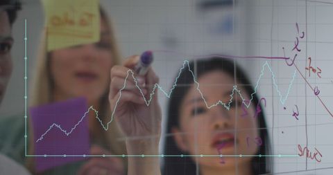 Businesswoman Analyzing Data on Transparent Screen in Office - Download Free Stock Images Pikwizard.com