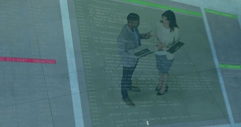Professionals collaborating over tablet with code overlay in modern glass atrium lobby