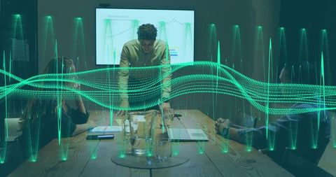 Executive presenting data waveform visualization in boardroom leading team collaboration