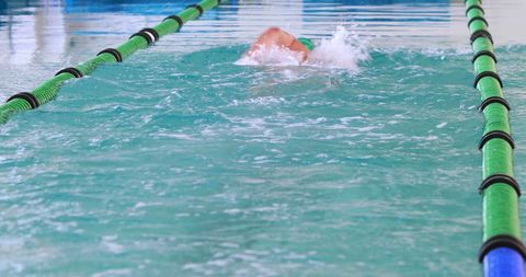 Athlete Swimming Freestyle in Pool Lane - Download Free Stock Images Pikwizard.com