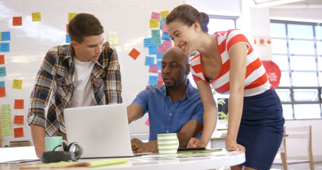 Diverse Team Collaborating in Bright Office with Sticky Notes on Wall - Download Free Stock Images Pikwizard.com