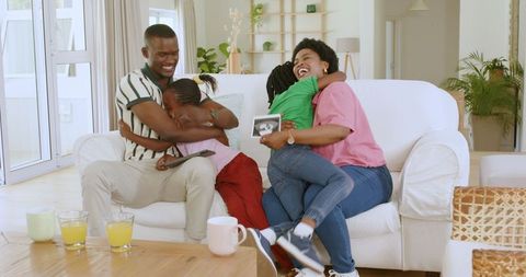 Joyful Family Celebrating New Pregnancy Exciting News