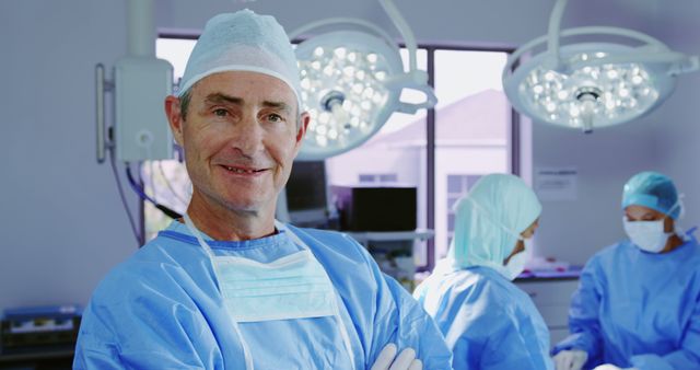 Confident Surgeon Standing in Operating Room with Medical Team Working - Download Free Stock Images Pikwizard.com